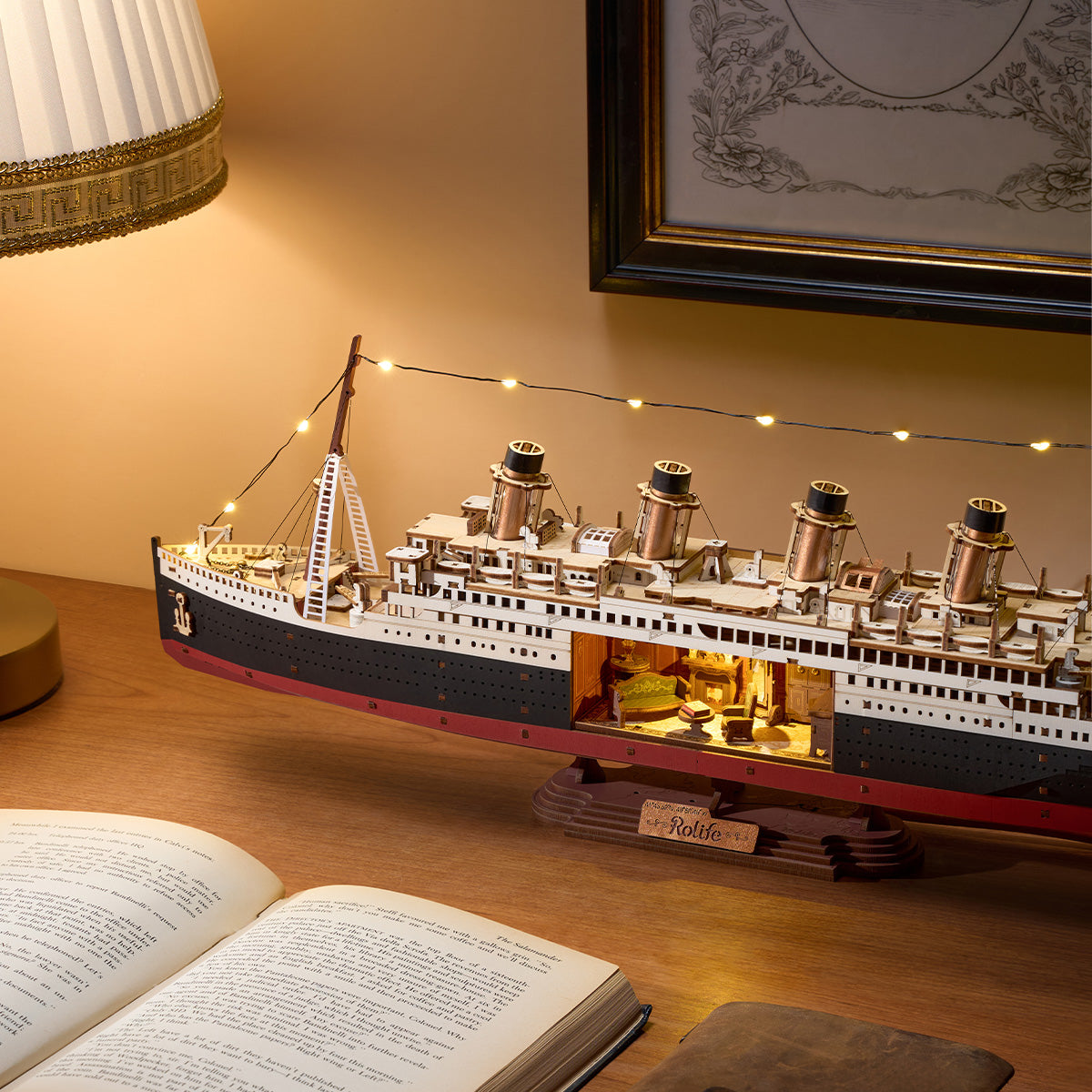 1912 Eternal Atlantic Voyager TGL02 ship model displayed on a desk with warm lighting