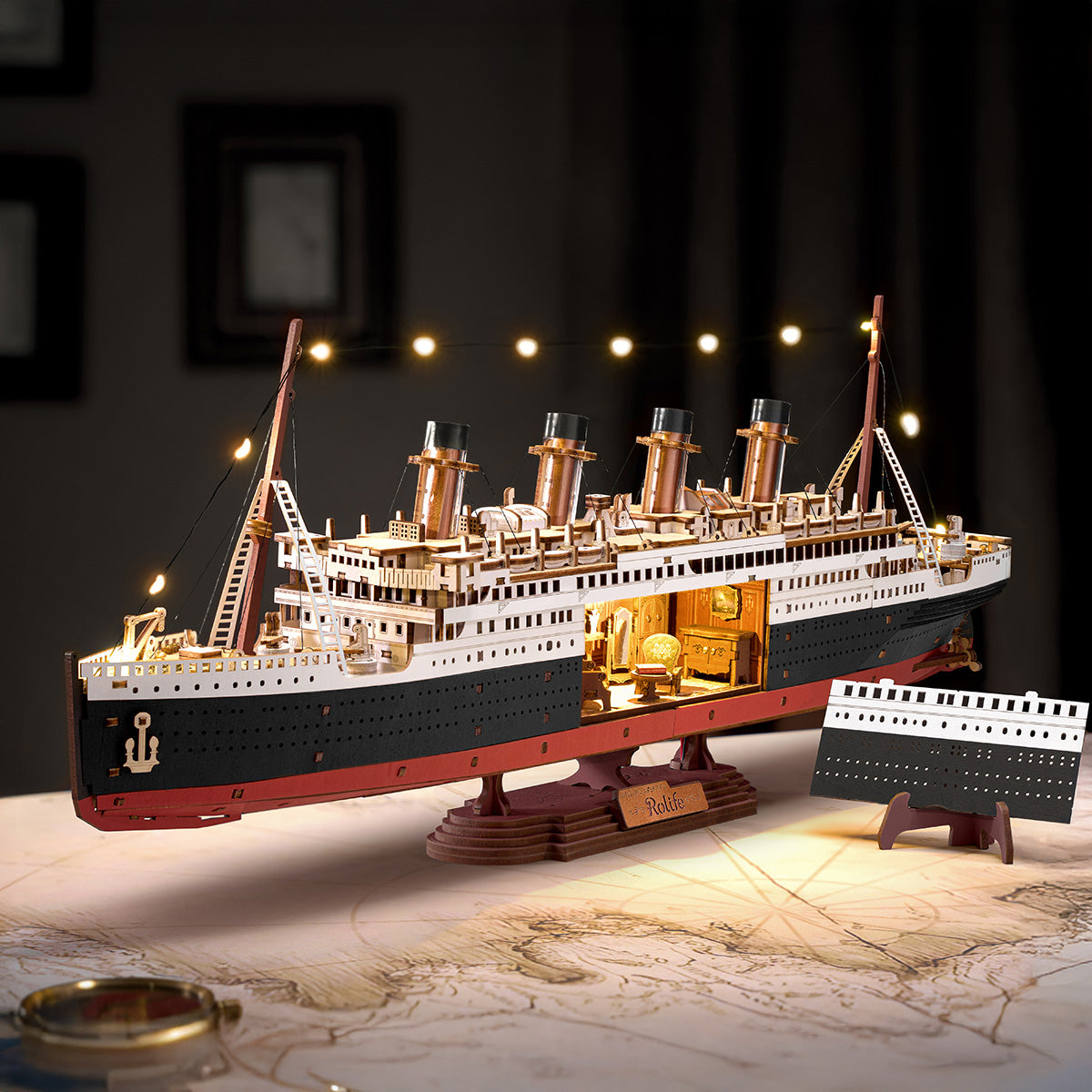 Rolife 1912 Eternal Atlantic Voyager TGL02 ship model in a warm desk display scene