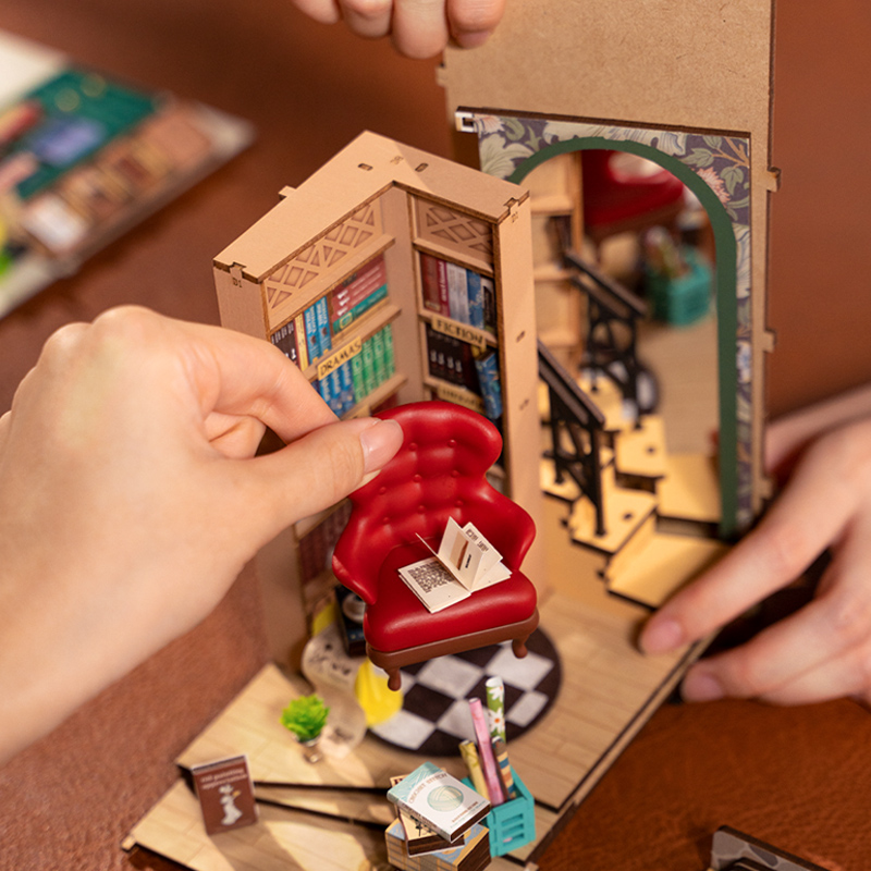 Rolife DIY Book Nook Kit - Bookstore TGB07 hands-on assembly scene with chair
