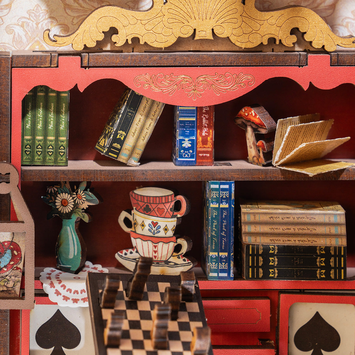 Fall into Wonder TGB12 shelf detail with teacups, books, and checkered tea table