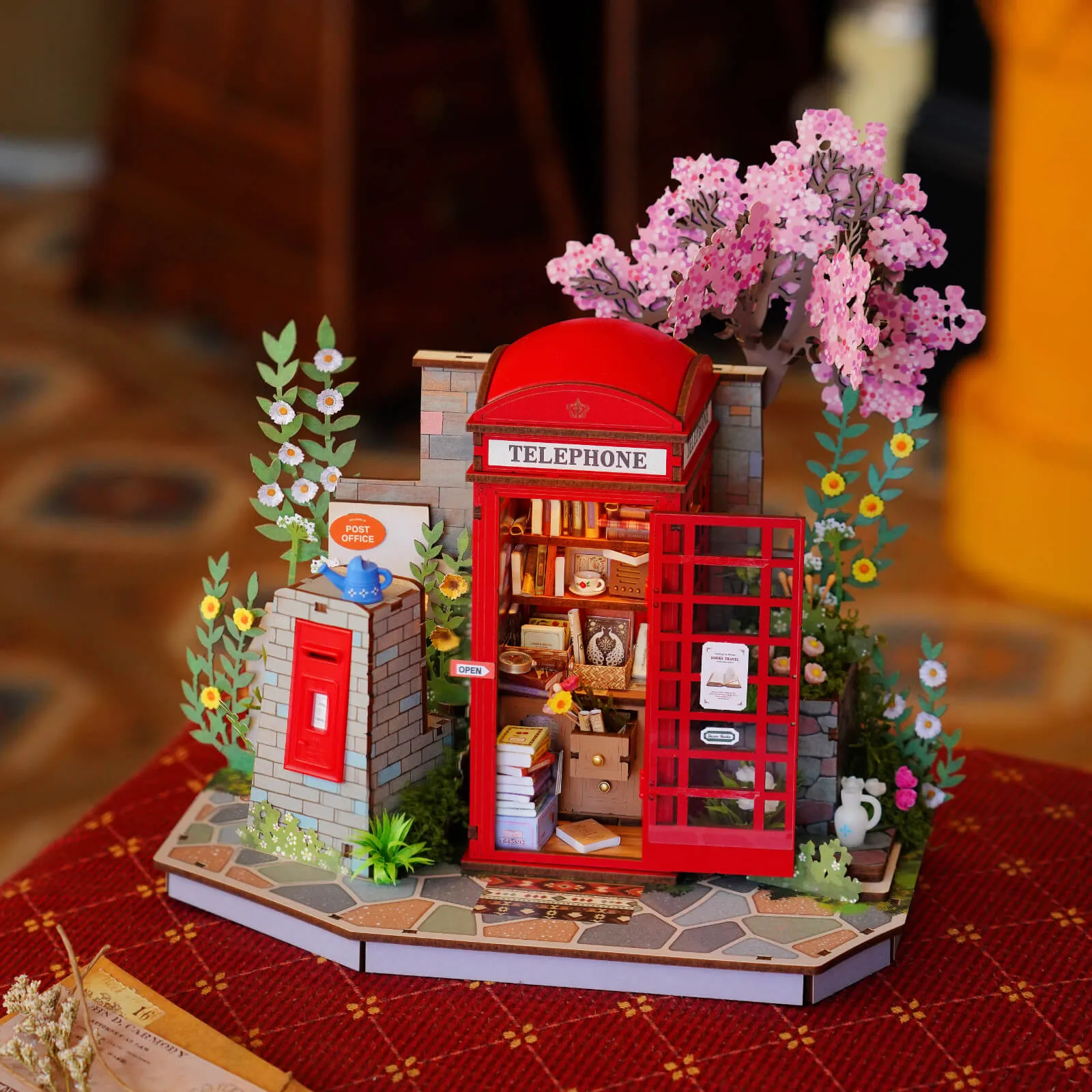 Blossom Book Booth displayed on a warm wooden table with lights on