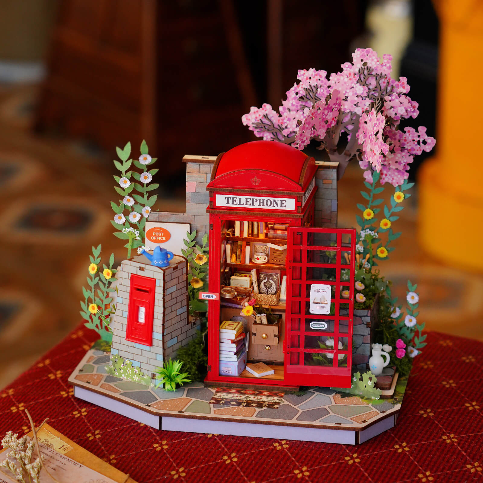Blossom Book Booth displayed on a warm wooden table with lights on