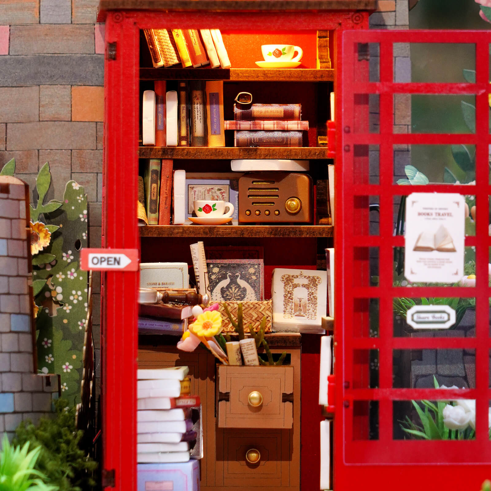 Close-up of Blossom Book Booth interior shelves, books, drawers, and open door