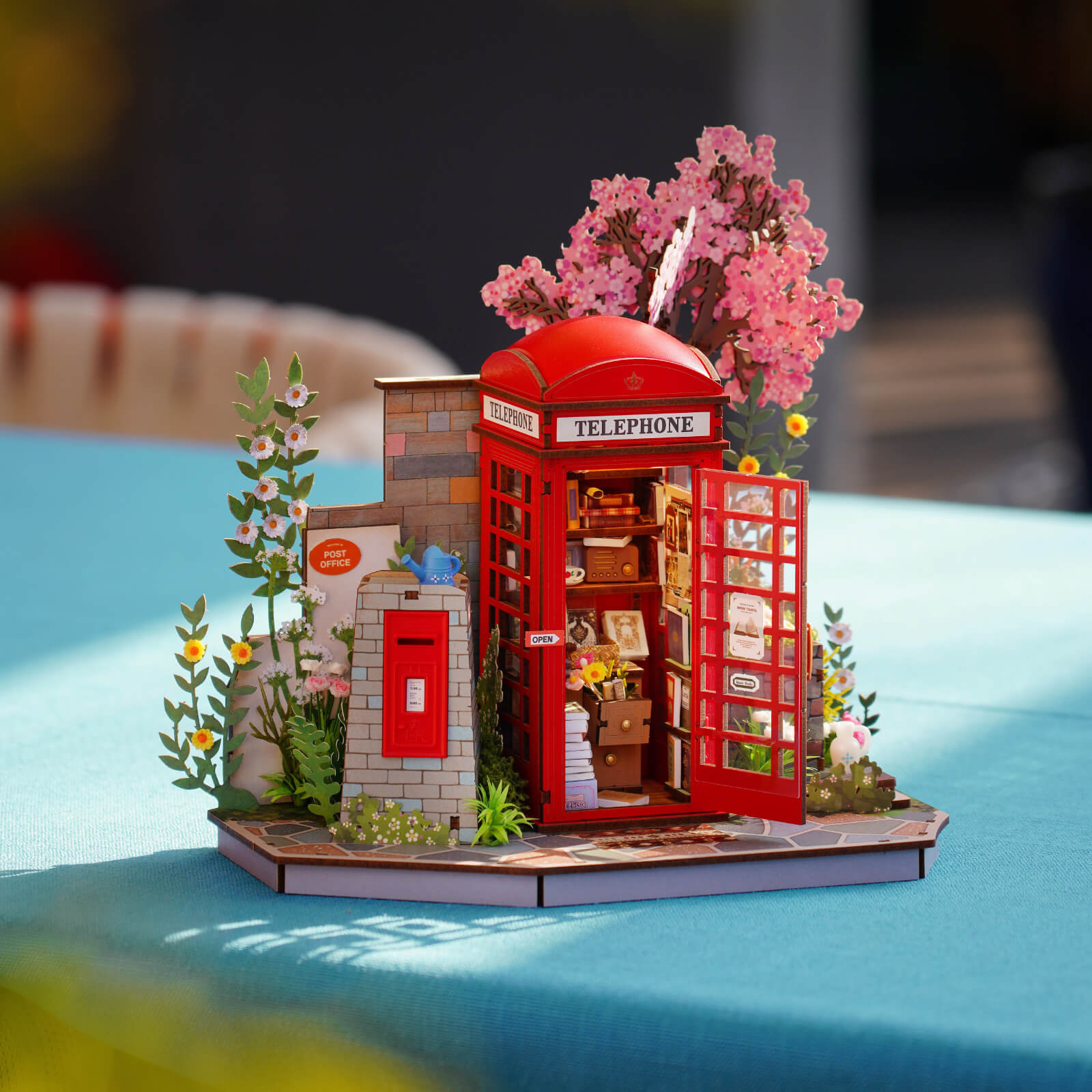 Blossom Book Booth TGS05 glowing night scene with red booth and flowers