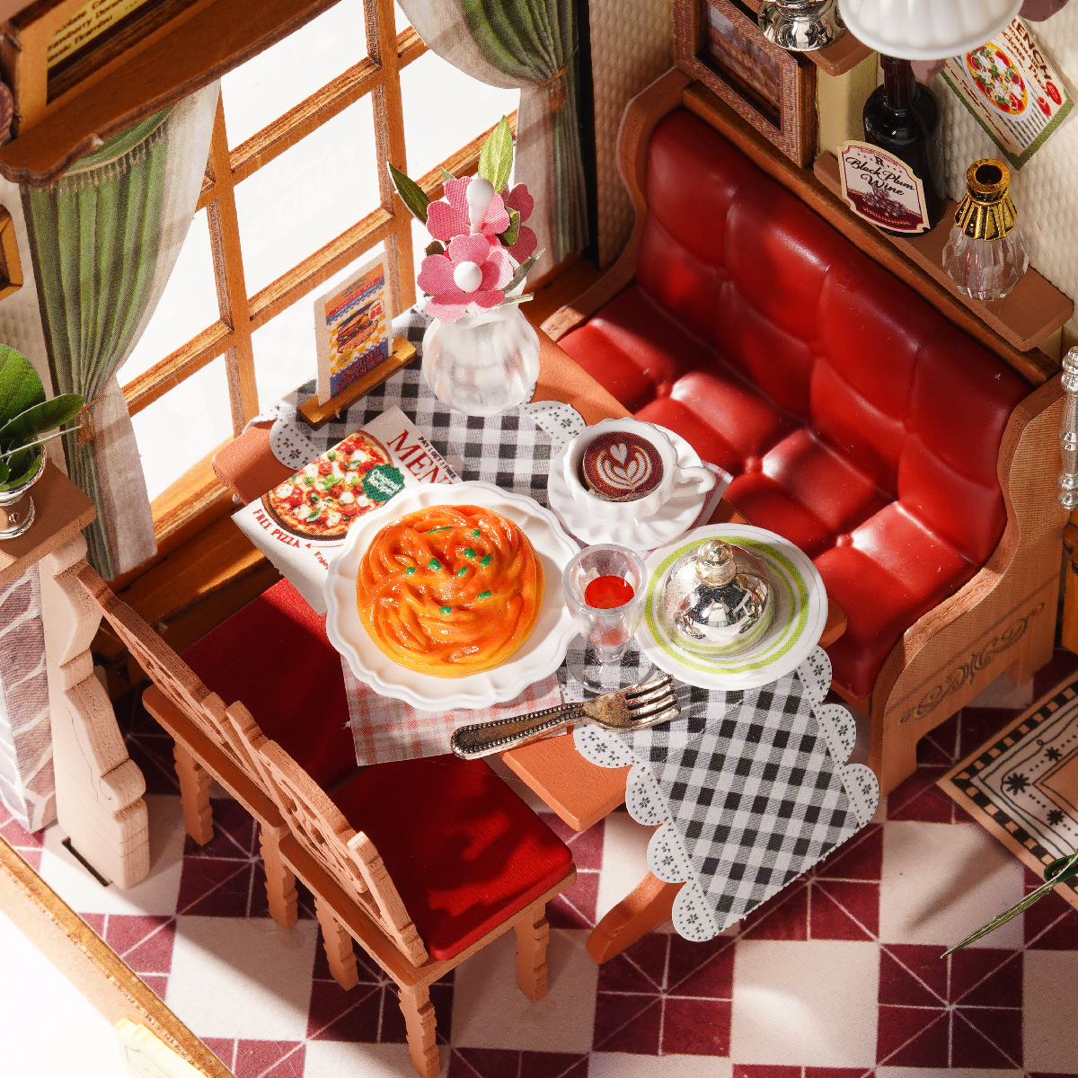 Champs-Elysees Bistro table detail with red booth, plates, drinks, and dessert