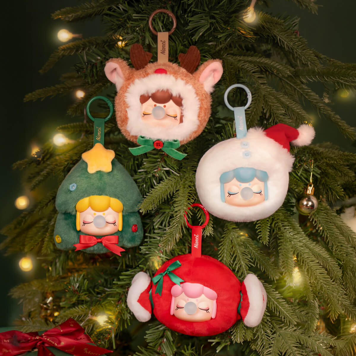 Nanci Christmas Gift ornament collection hanging on a Christmas tree