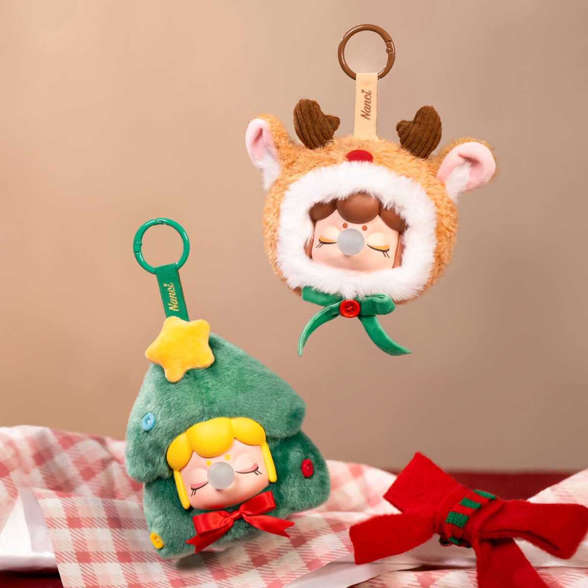 Nanci Christmas Gift reindeer and Christmas tree pendants in a styled scene