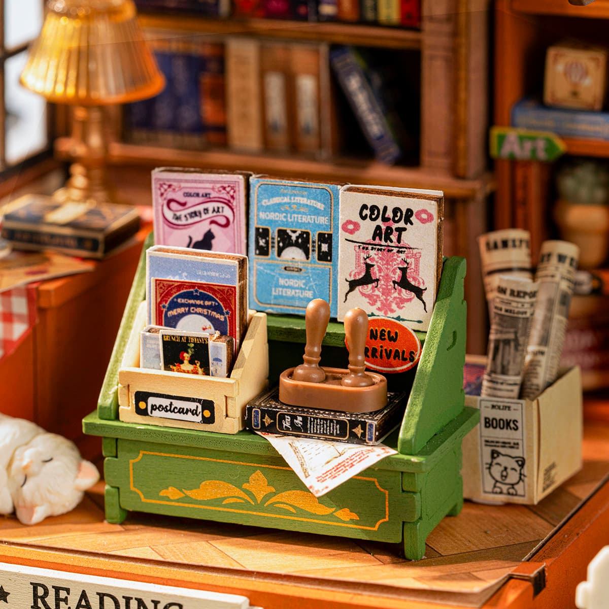 Rolife DIY Miniature House - The Muse Bookshop DS040 bookshelf and reading accessories detail close-up