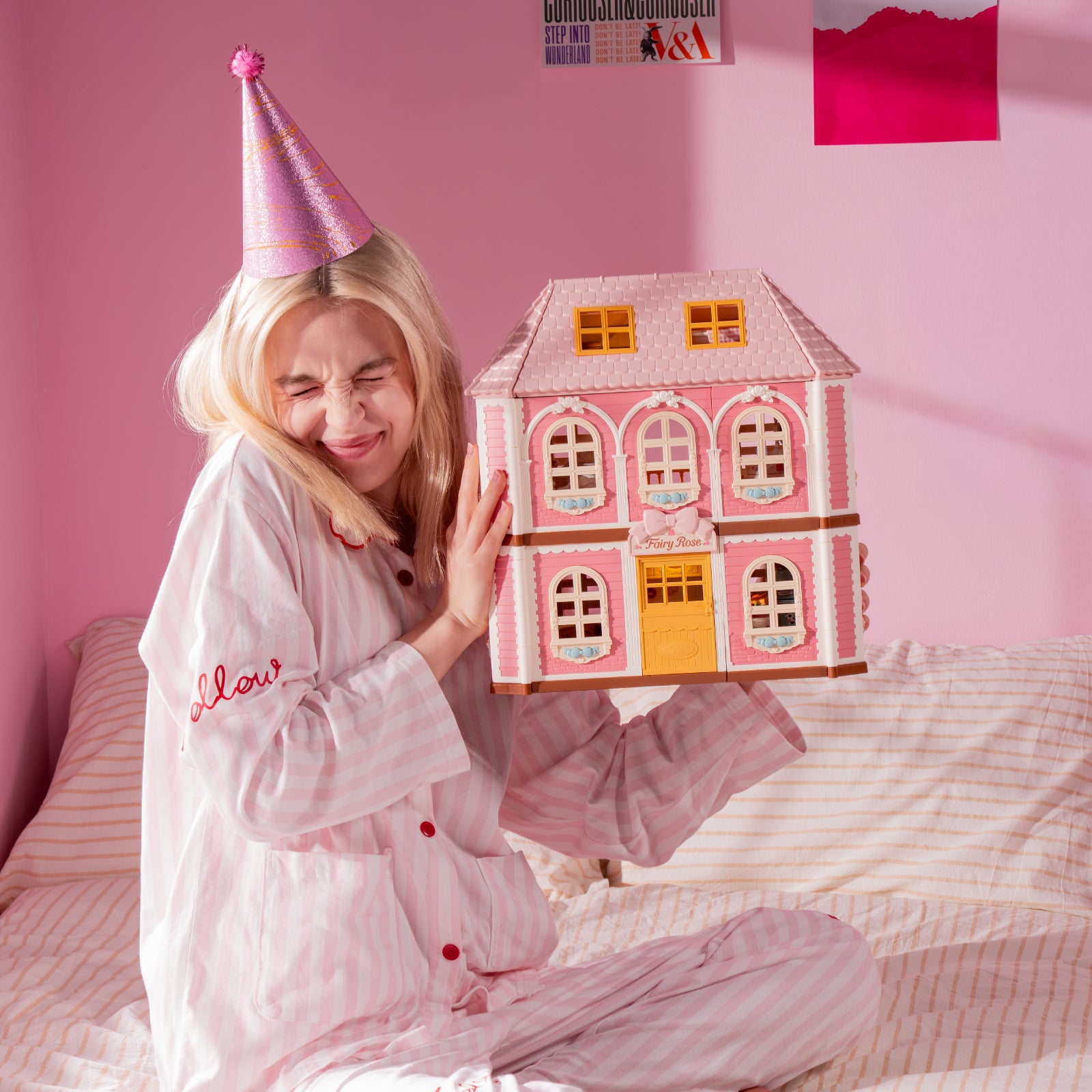 Rolife Fairy Rose Cottage HH001 closed pink dollhouse held in a bedroom scene.