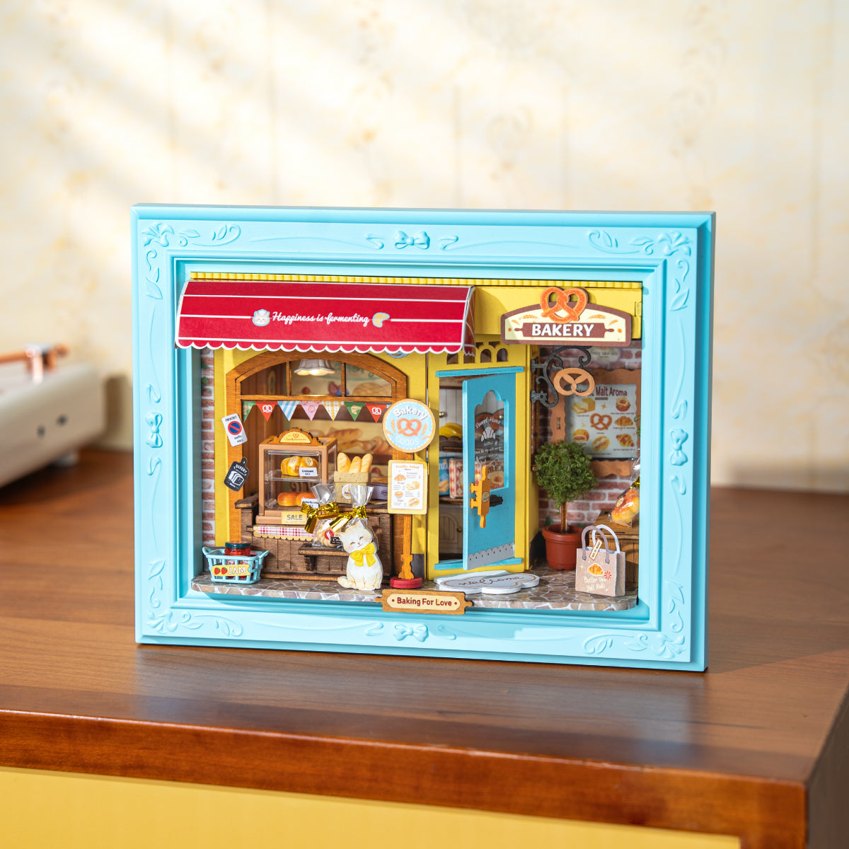 Rolife Fluffy Cat Bakery DP001 story frame displayed on a tabletop