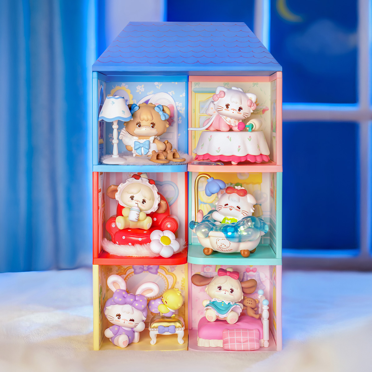 Mikko Babies Little World full collection display in a blue shelf scene