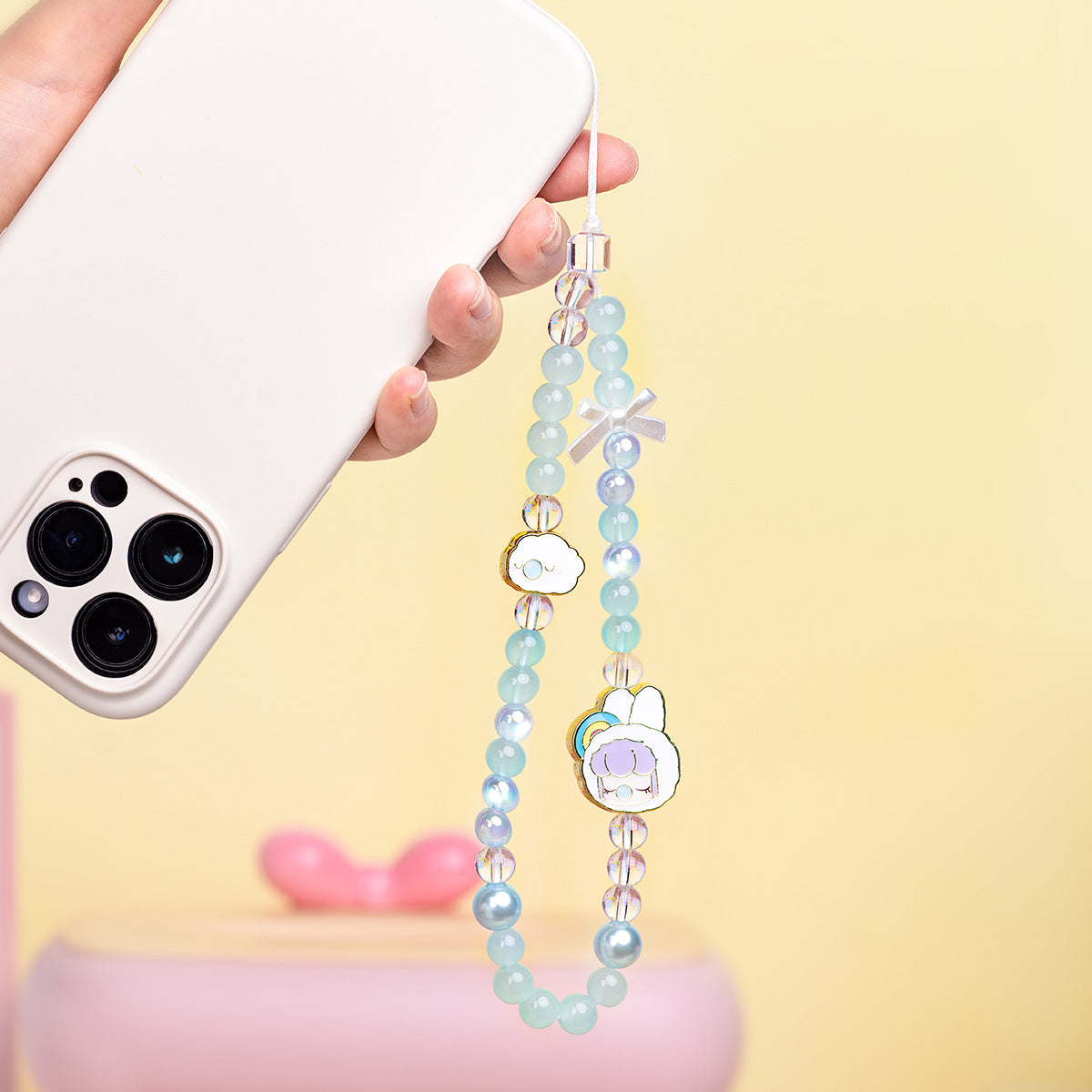 Nanci Sweet Time phone lanyard attached to a smartphone