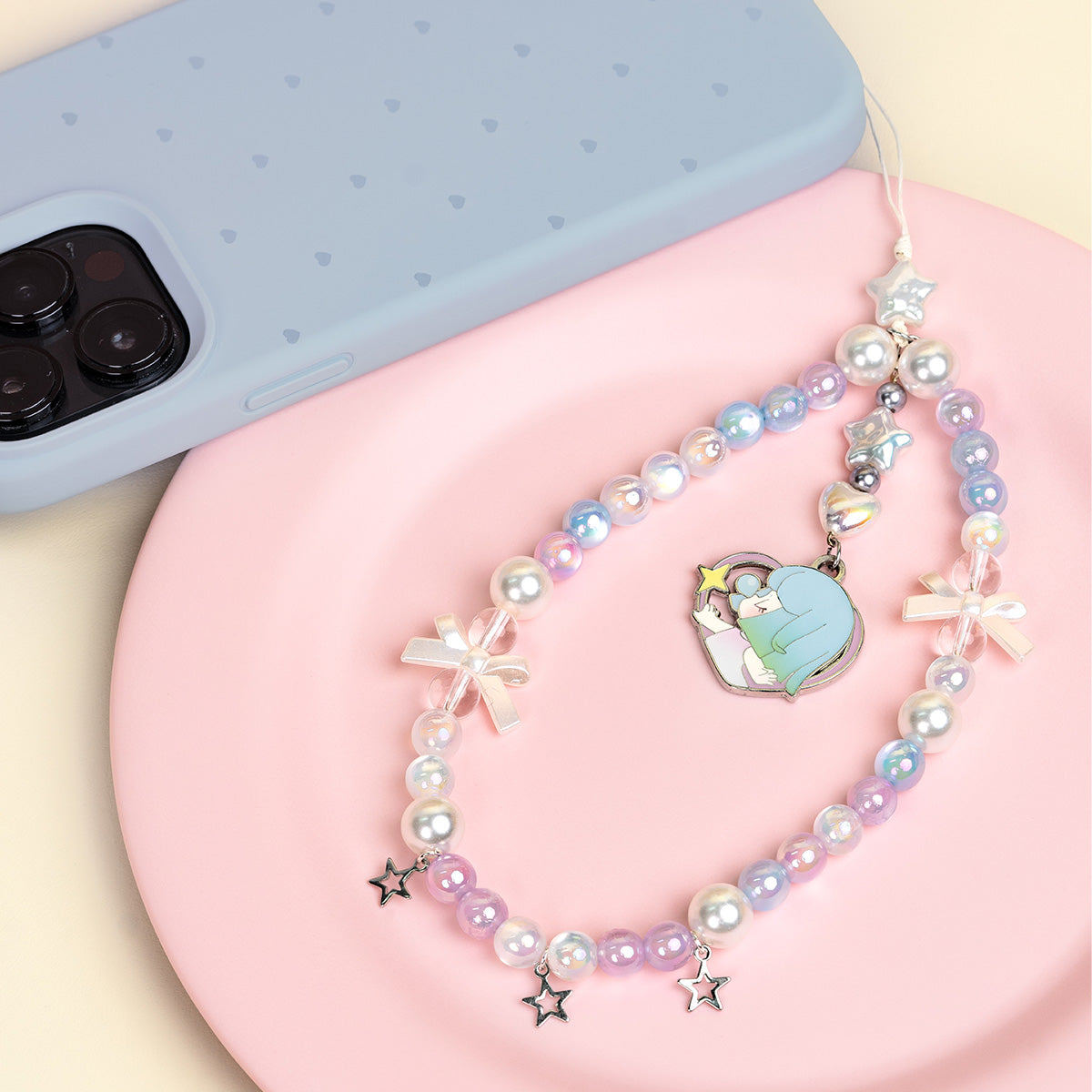 Nanci Sweet Time hidden edition phone lanyard on a pink tray