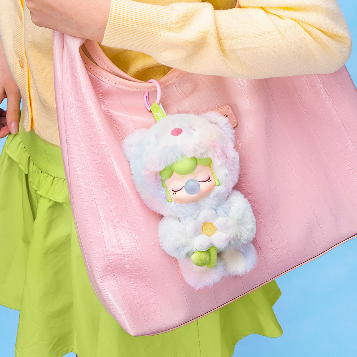 Rolife Nanci Spring Bear MN003 plush pendant attached to a pink bag.