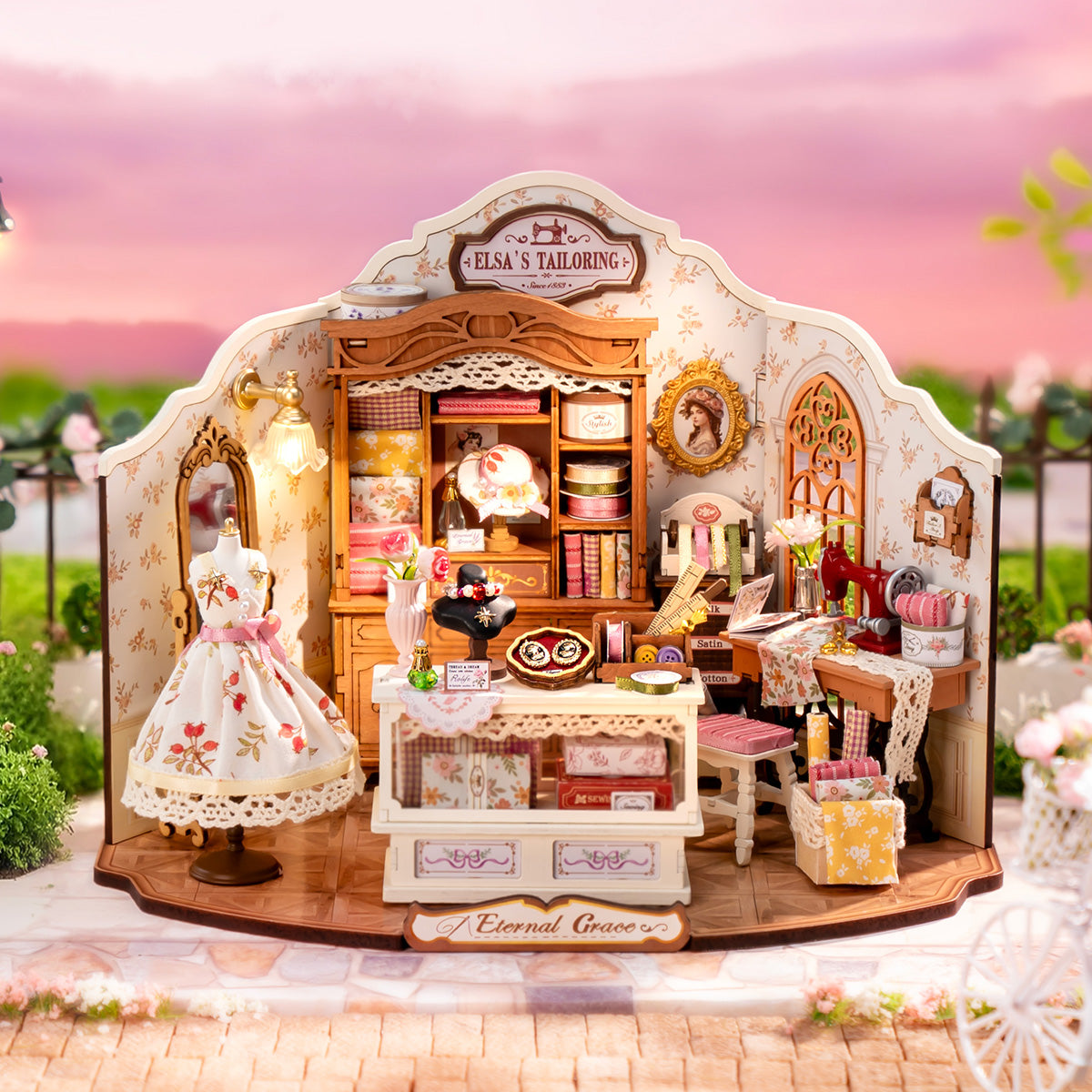Rolife Elsa's Tailoring DG178 miniature house in a warm sunset display scene