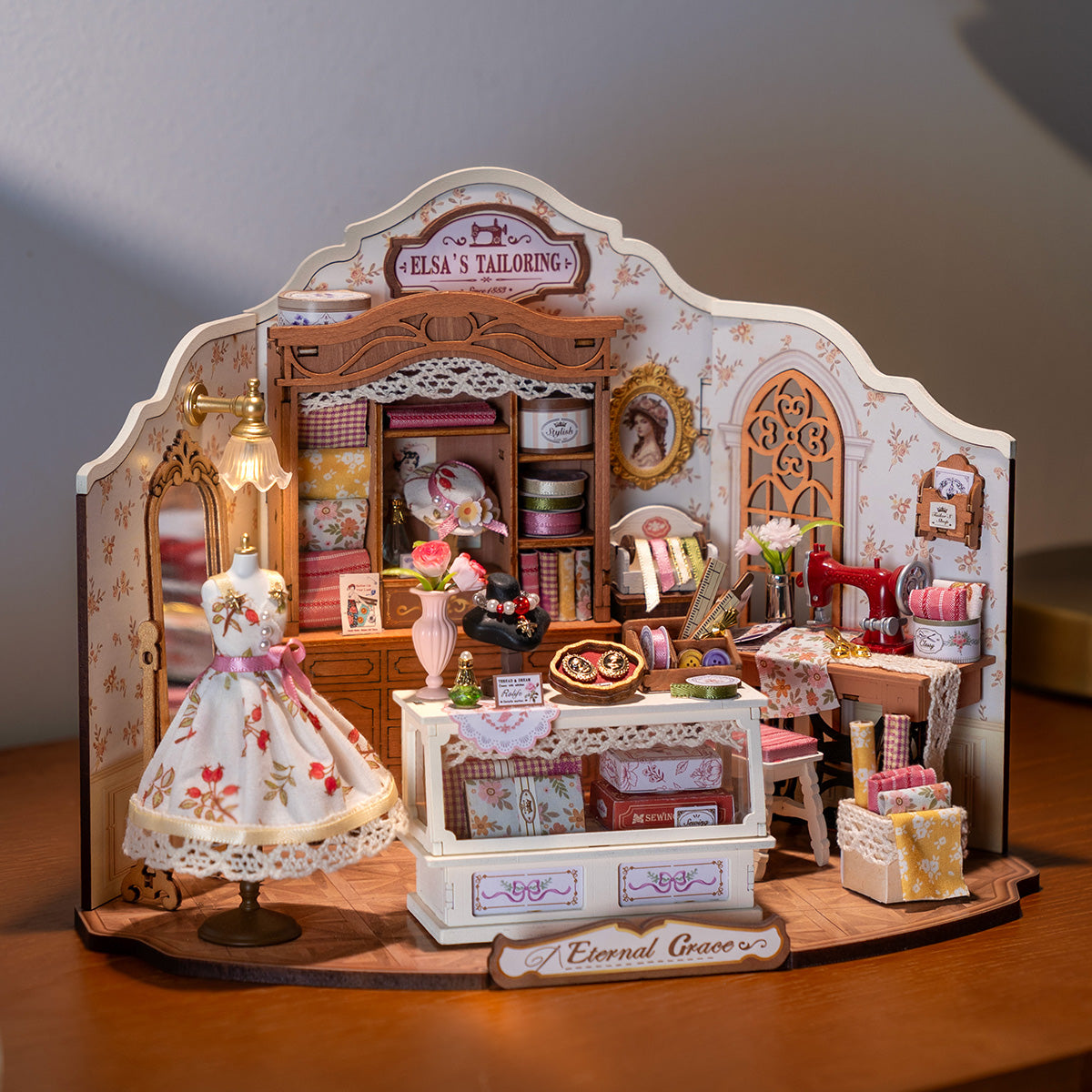 Elsa's Tailoring DG178 tabletop display scene with warm lighting