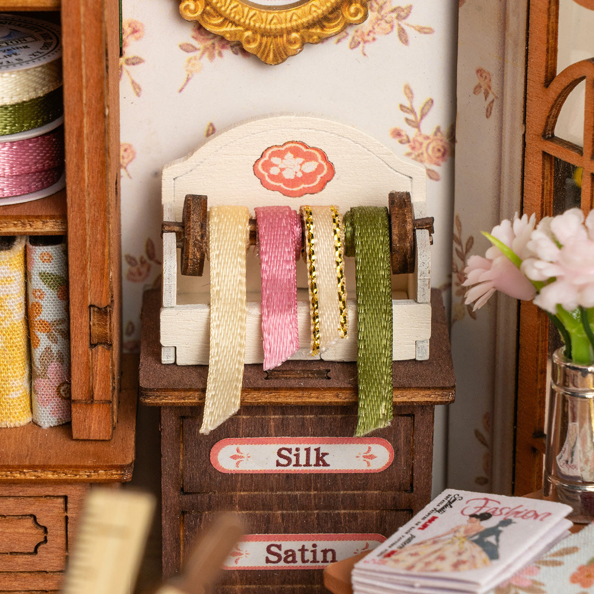 Elsa's Tailoring DG178 close-up of the fabric cabinet and ribbon display details