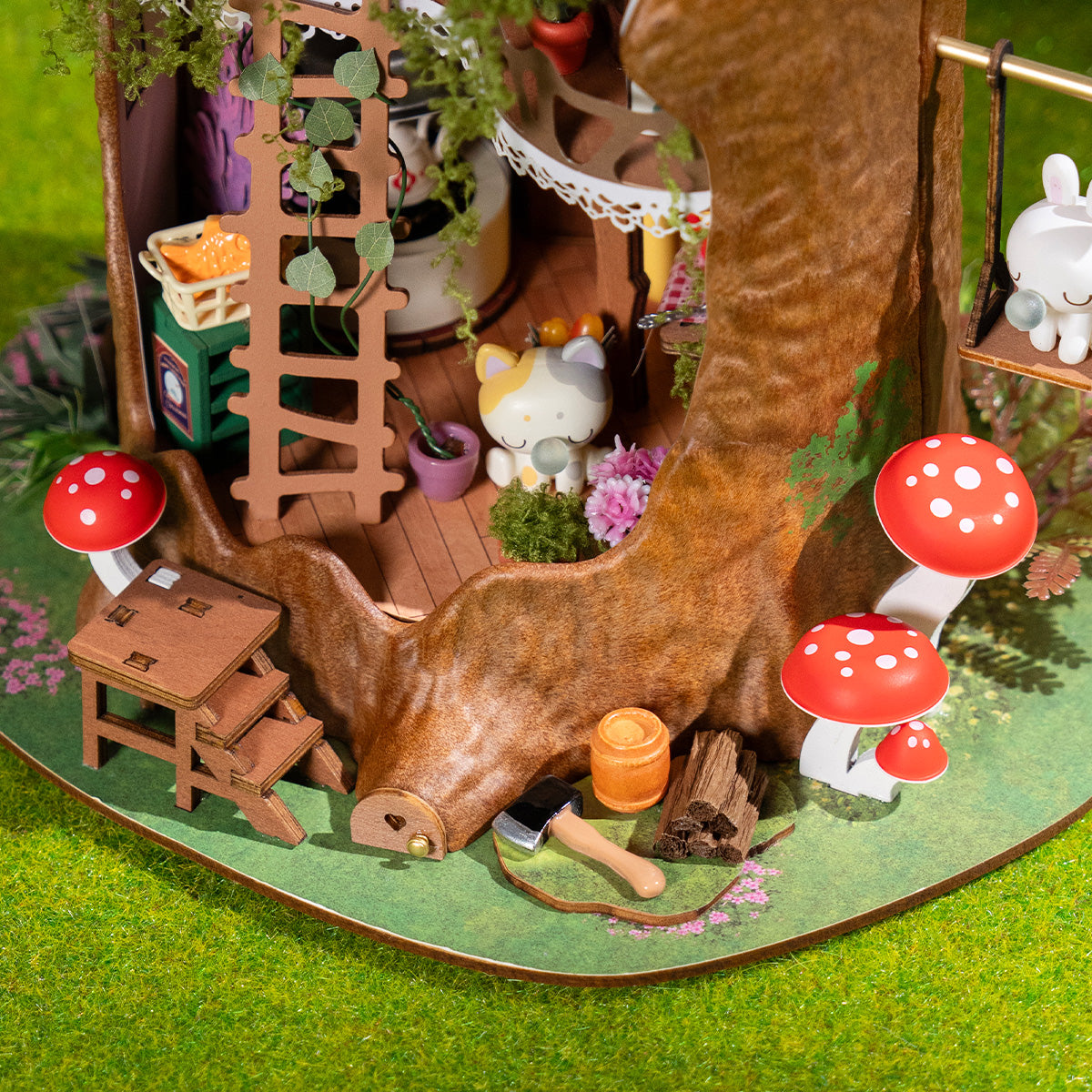 Fairytale Tree House DG179 close-up of the ladder, swing, and mushroom garden details