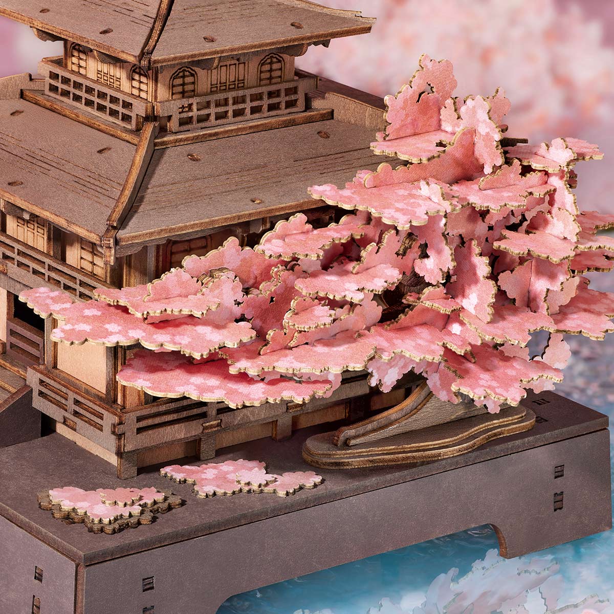 Close-up of the Rolife Sakura Pavilion pink cherry blossom tree and wooden pavilion details