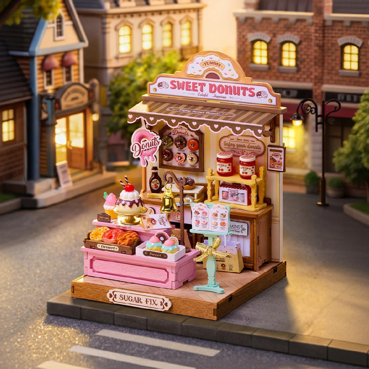 Sweetie's Donut Shop DS051 miniature bakery stand in a cozy street scene