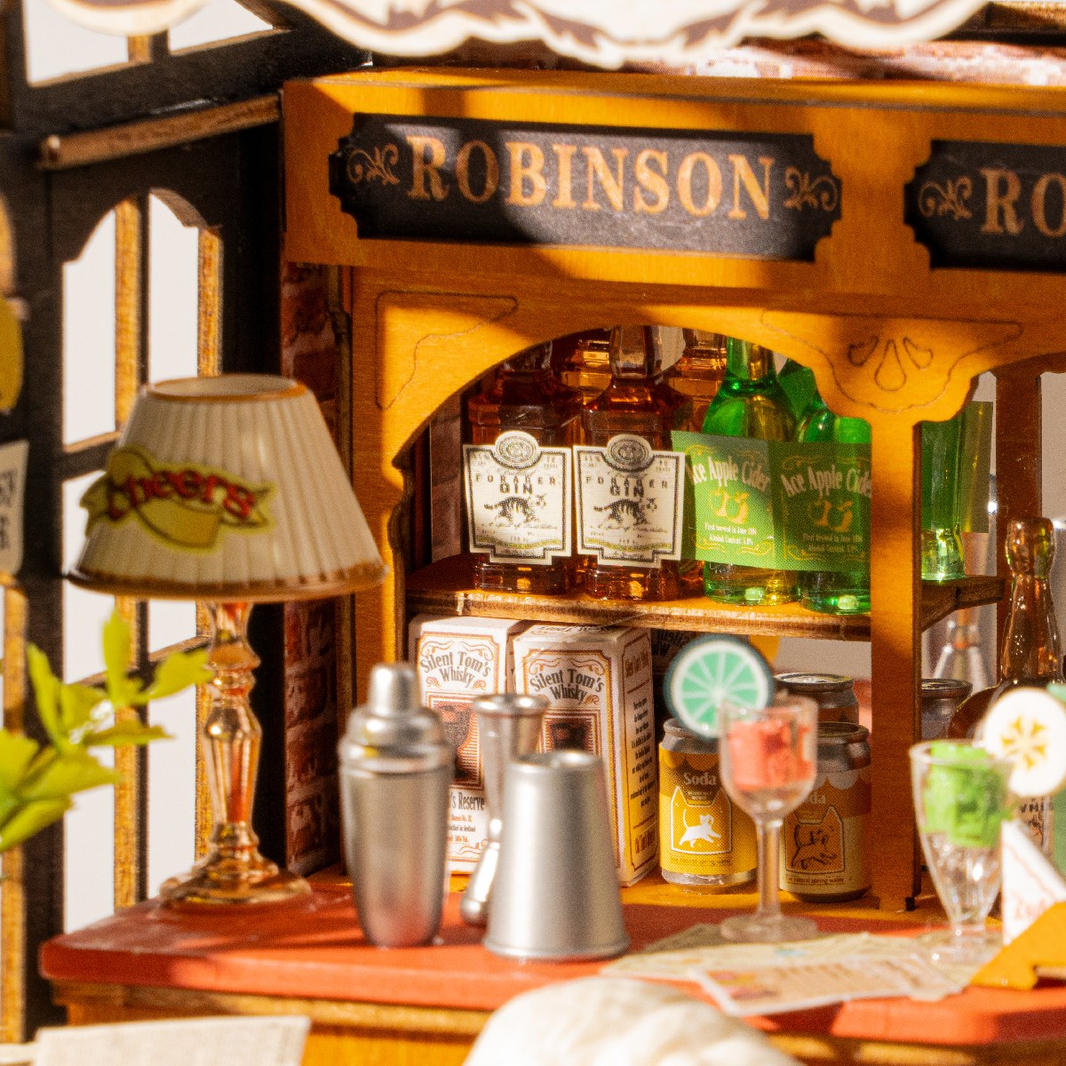 Close-up of Tipsy Cat Bar shelves with bottles, glasses, and lamp details