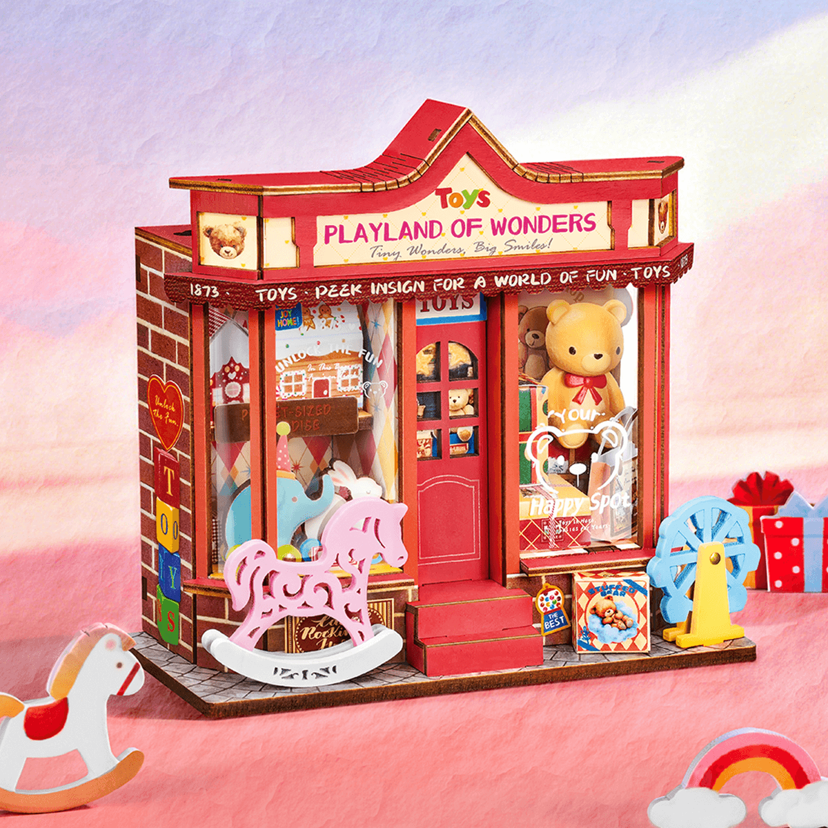 Rolife Whimsy Toy Shop DS044 miniature toy store in a styled pink display scene