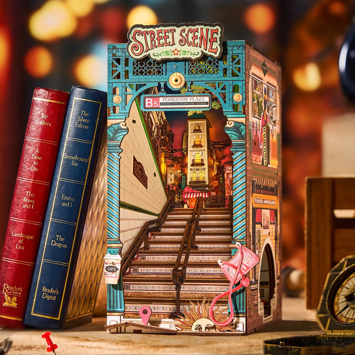 Rolife Street Scene TGB13 book nook in a warm tabletop display beside books