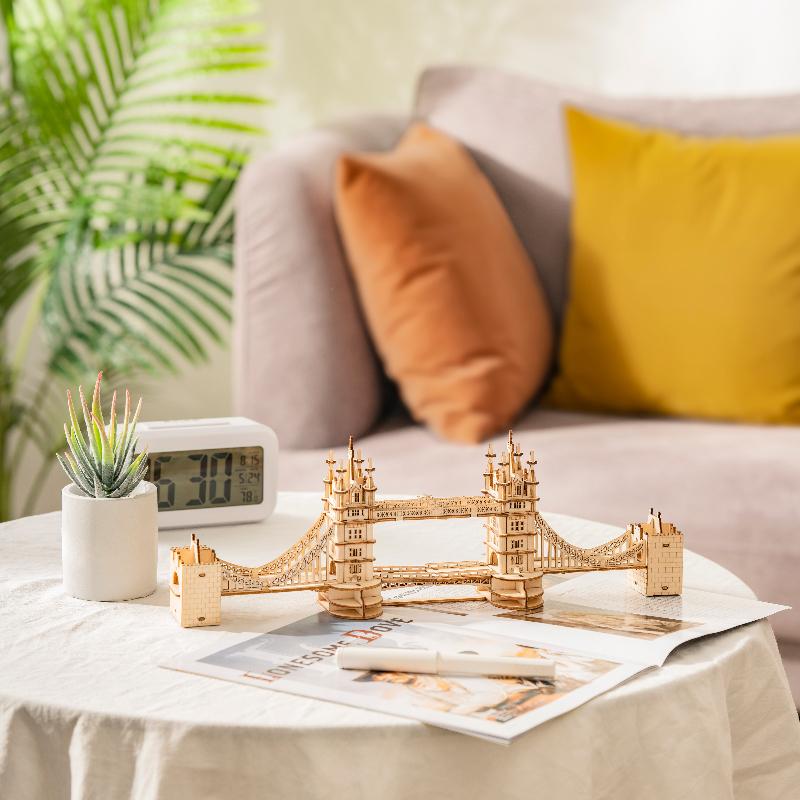 Rolife Tower Bridge TG412 displayed on a table beside books and home decor