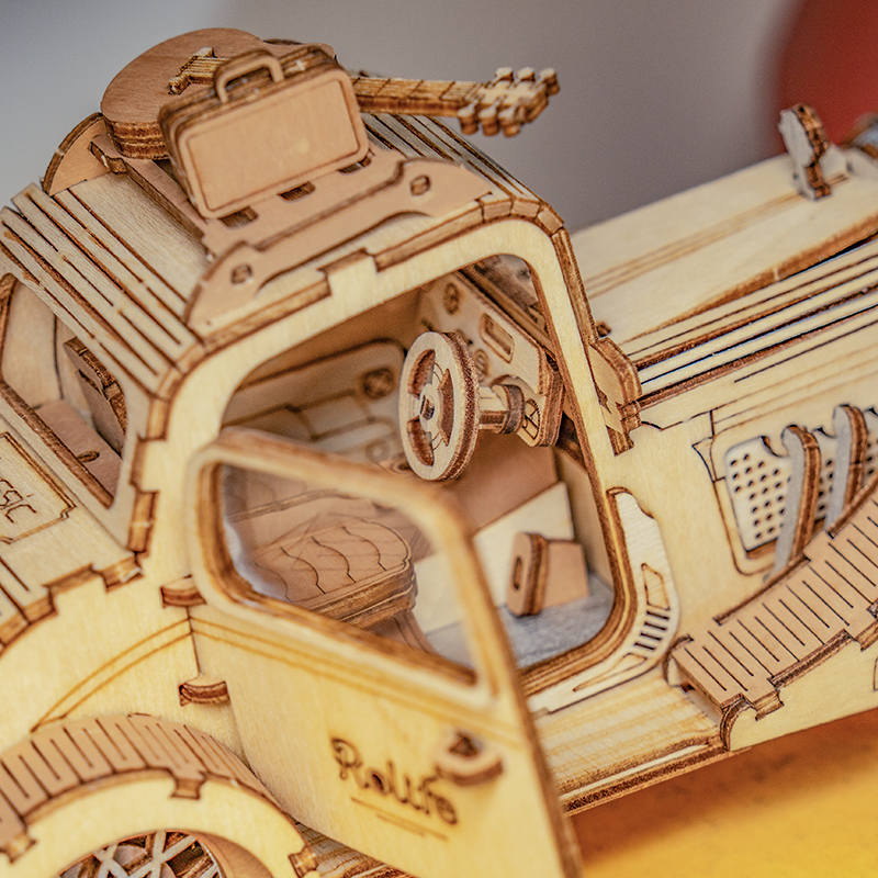 Close-up of the Rolife Vintage Car interior seat and steering wheel