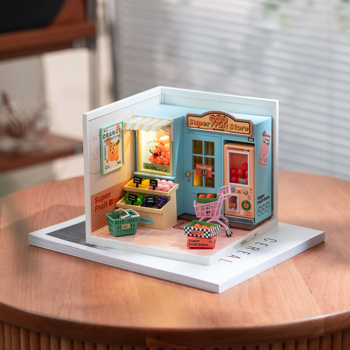 Rolife Super Fruit Store Super Creator Miniature House DW003 tabletop display on a round table