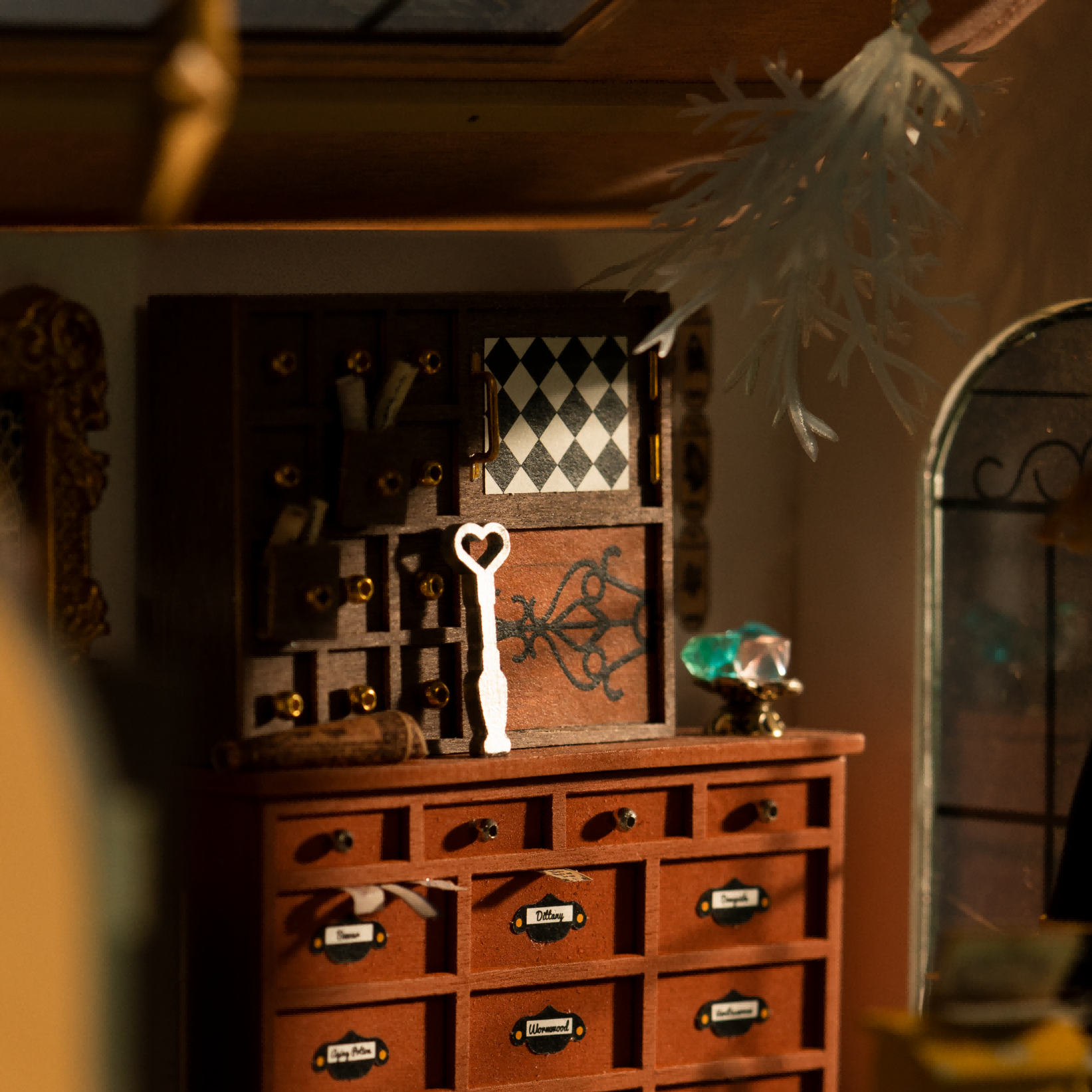 Close-up of Kiki's Magic Emporium wooden drawer cabinet and hanging keys